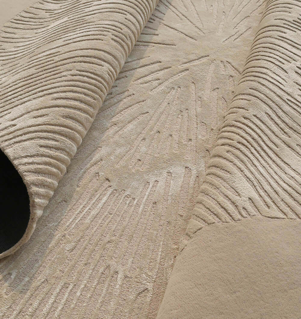 Aurora Bloom Rug showcasing a sunburst pattern, blending organic textures with modern style, in a luxurious wool and viscose blend.