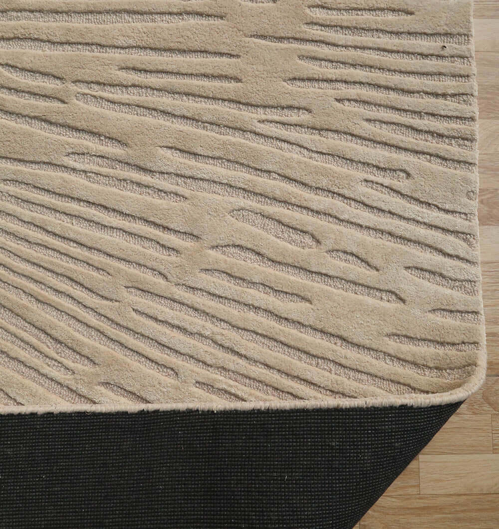 Close-up of the Aurora Bloom Rug showcasing its textured, nature-inspired design and luxurious materials.