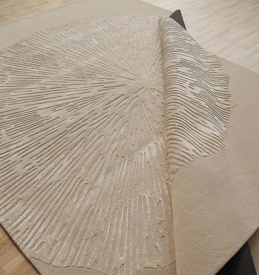 Close-up of the Aurora Bloom Rug showcasing its sunburst pattern and luxurious texture.