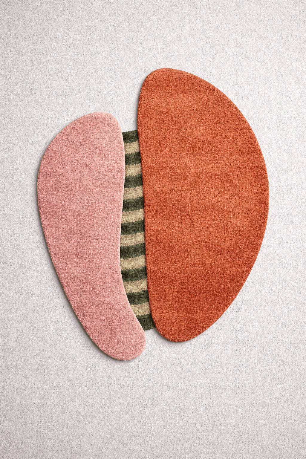 Abstract wool rug for modern home featuring blush pink, terracotta, and olive-beige colors.