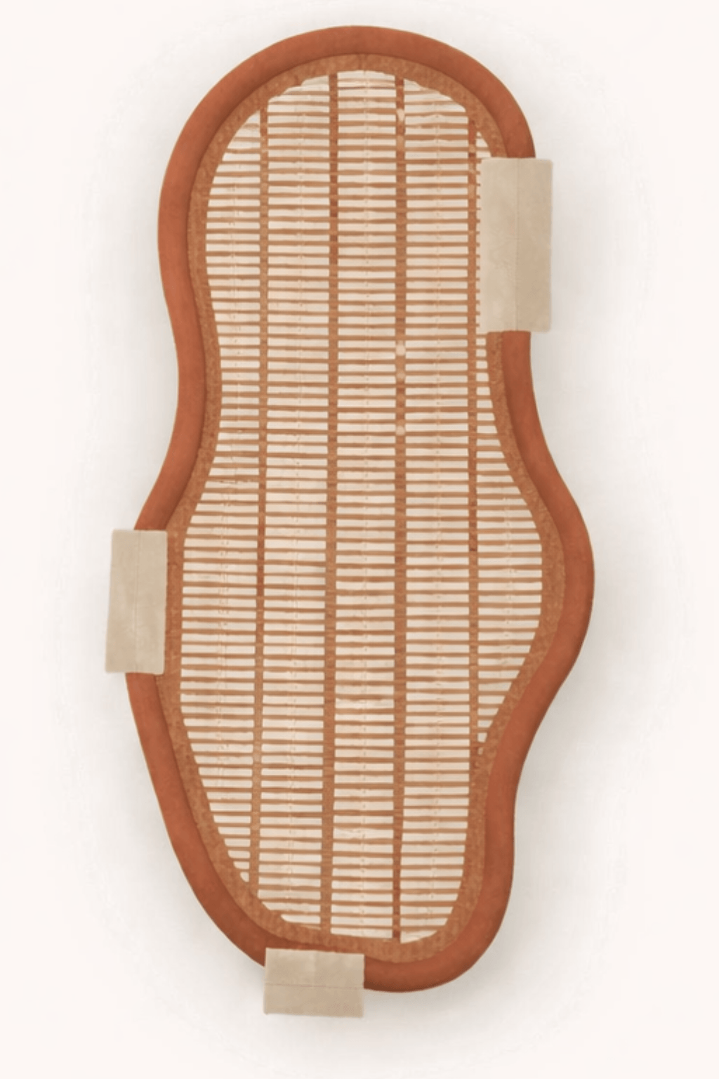 Organic geometric area rug with soft asymmetrical silhouette and natural tones for a serene living space.