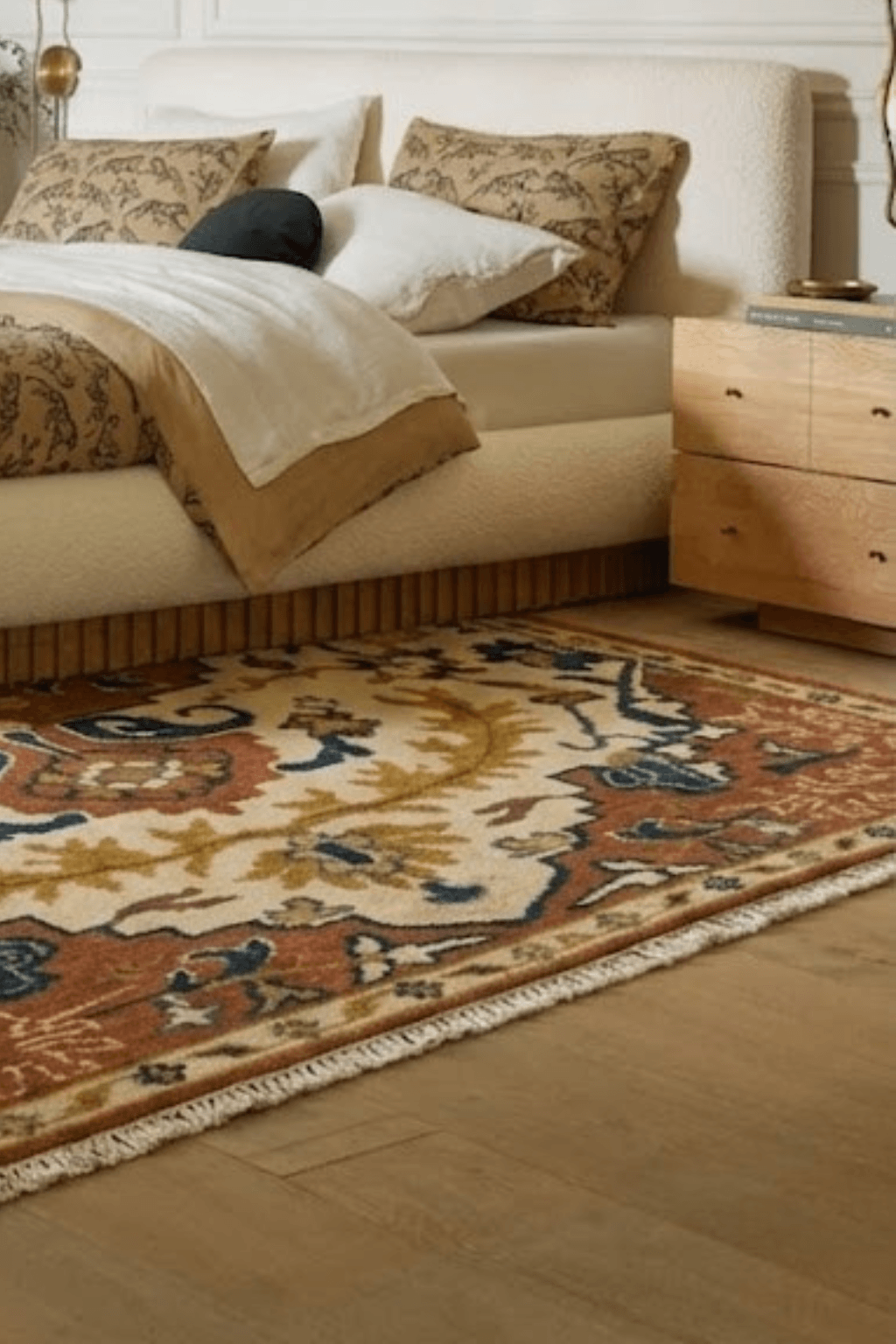 Hand-knotted wool medallion rug in a stylish bedroom setting with elegant decor.